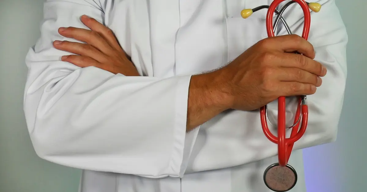 A doctor holding a statoscope