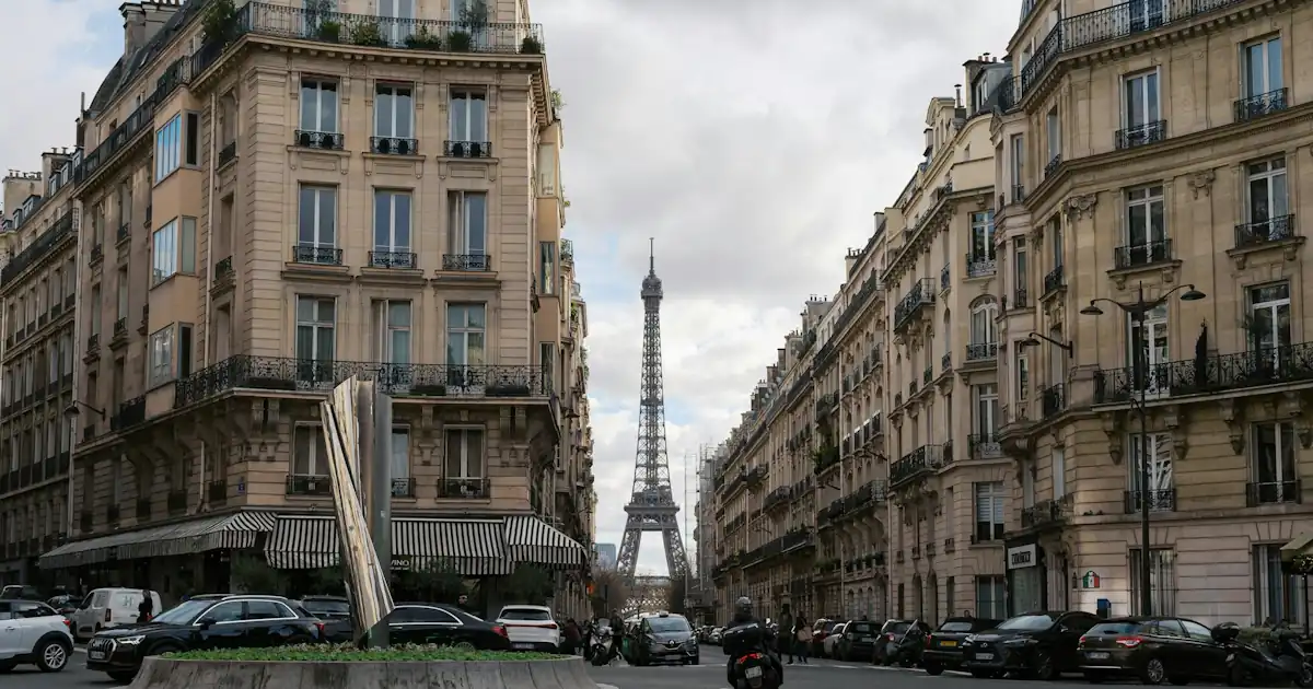 Haussmann-style buildings and a tree-lined street in Paris