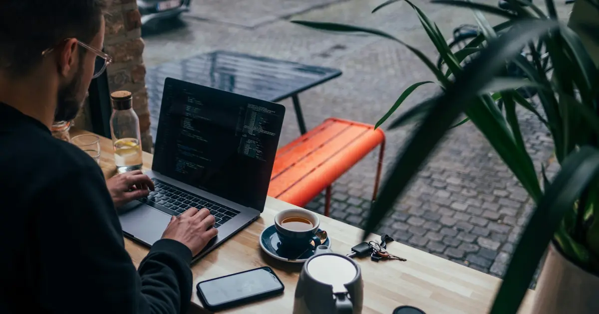 Laptop on a cafe table in a French city